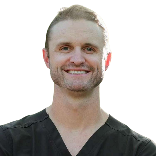 Smiling male healthcare professional in black scrubs against a white background, facing the camera